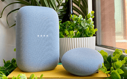 A Google Home device sitting on a table in an accessible smart home setup